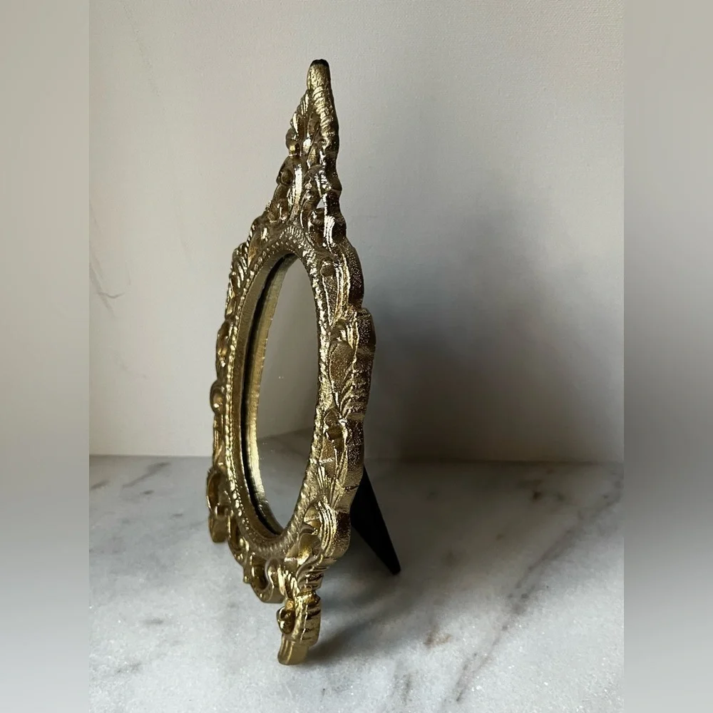Ornate Vanity Mirror Oval metal Frame Scrollwork Tabletop Stand..